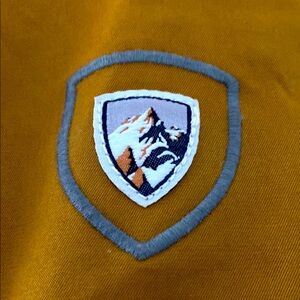 KUHL Women's multi-season Dark Khaki Jacket with its infamous Mtn Logo Patch